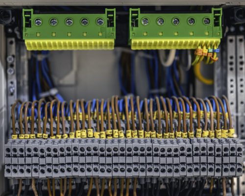 Voltage distributor with automatic switches. Electrical background.
